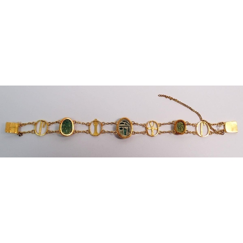 540 - An antique gold and scarab beetle bracelet with four decorative oval links and three scarabs, 19g - ... 