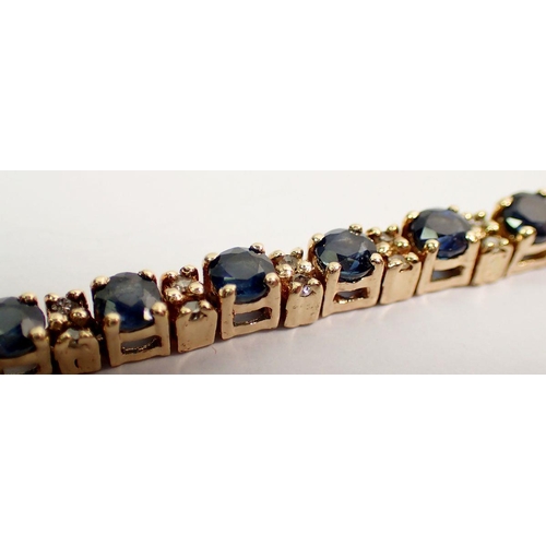 547 - A 9 carat gold sapphire and diamond tennis bracelet, 9.5g