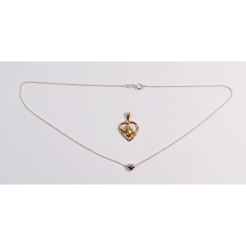 560 - An 18 carat gold cupid and heart pendant set diamond, 2g plus a silver heart pendant necklace