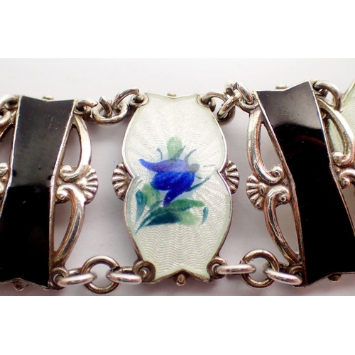 563 - A Norwegian silver and enamel bracelet with six floral enamel panels by Ivor T Holth, 2cm wide