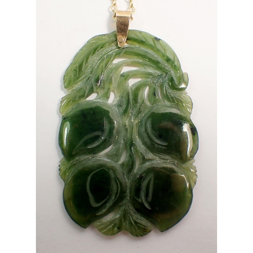 565 - A jade pendant necklace with 9 carat gold chain, 4.5 x 3cm, chain 45cm long, chain 1.9g