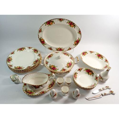 57 - A Royal Albert Country Roses dinner service comprising meat plate, three egg cups, rose vase, small ... 