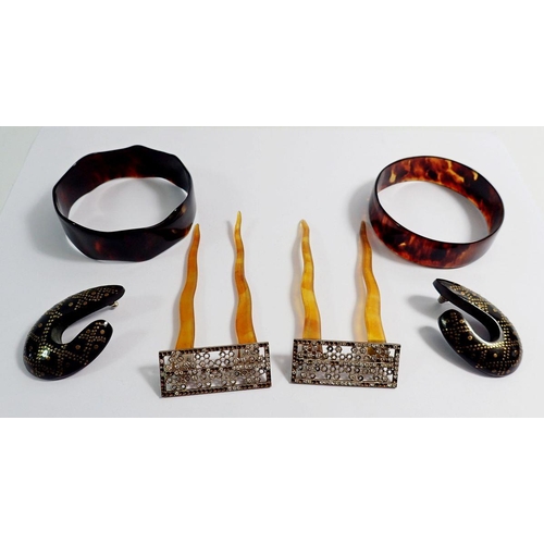 576 - Two tortoiseshell bangles, two hair combs inset paste and a pair of earrings