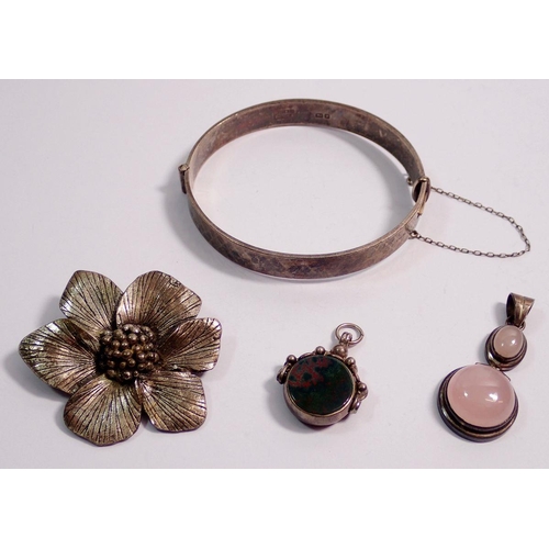 608 - A Miracle flower brooch, a white metal stone set fob, a silver and pink quartz pendant and a silver ... 