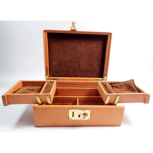 616 - A leather jewellery box with fitted cantilever interior, 22.5cm wide