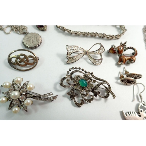 650 - A group of silver jewellery including brooches, earrings, bracelets, necklaces etc.