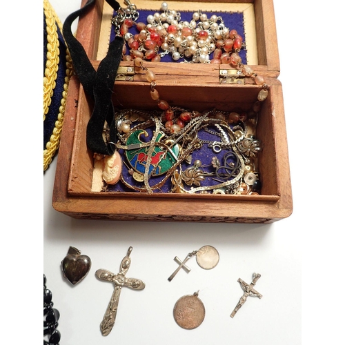 655 - A box of costume jewellery including silver heart locket, necklaces, bangle etc.