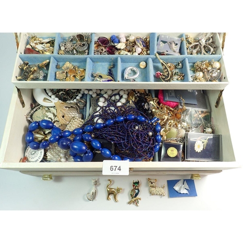 674 - A large collection of costume jewellery including necklaces, bracelets, brooches etc.