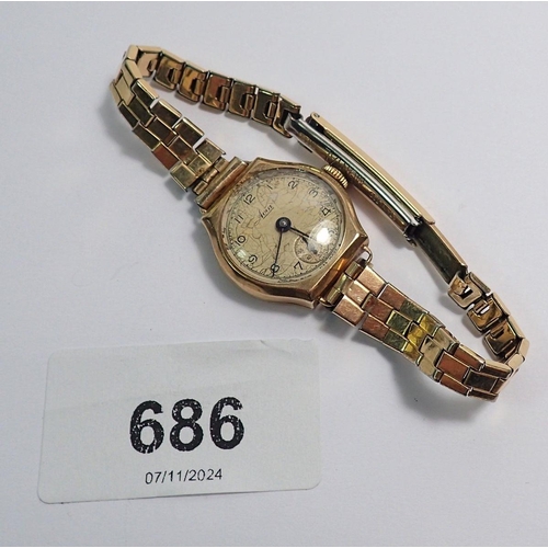 686 - An Avia 9 carat gold watch on gold plated strap