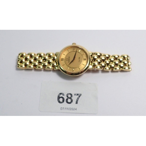 687 - An Omega ladies De Ville 18 carat gold wrist watch and strap, 42g total weight