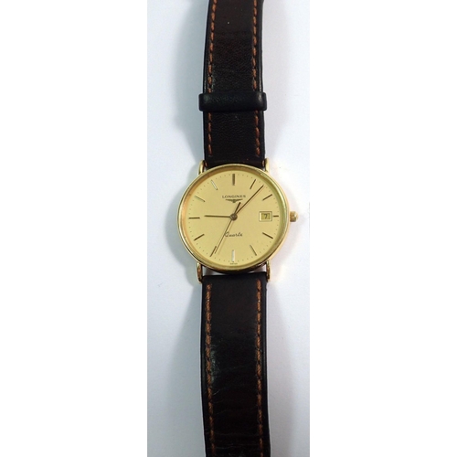 691 - An 18 carat gold Longines gentlemans quartz wrist watch with date niche