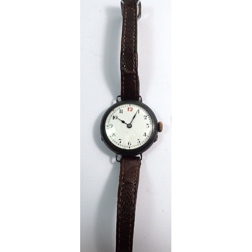 712 - An early 20th century silver wrist watch with enamel face