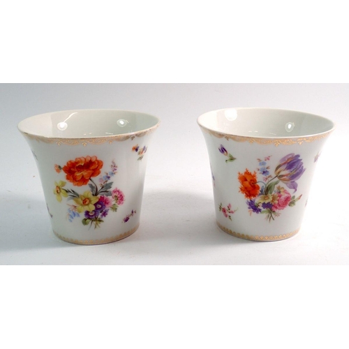 74 - A pair of German porcelain flared jardinieres with floral printed decoration,  blue crown mark to ba... 