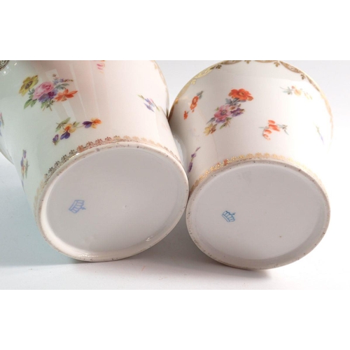 74 - A pair of German porcelain flared jardinieres with floral printed decoration,  blue crown mark to ba... 