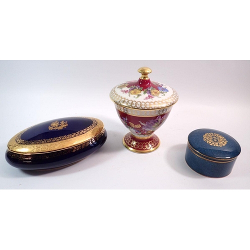 79 - A Limoges blue and gilt oval box, a Worcester gilt and blue box and a Bavarian floral vase and cover... 