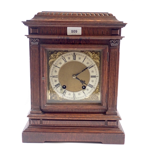 809 - A late Victorian oak bracket clock with brass face by Lenzkirch, 36cm high