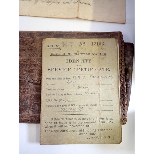 822 - A brown suitcase of Merchant Navy ephemera including Apprentice, Discharge, Competency and Service c... 