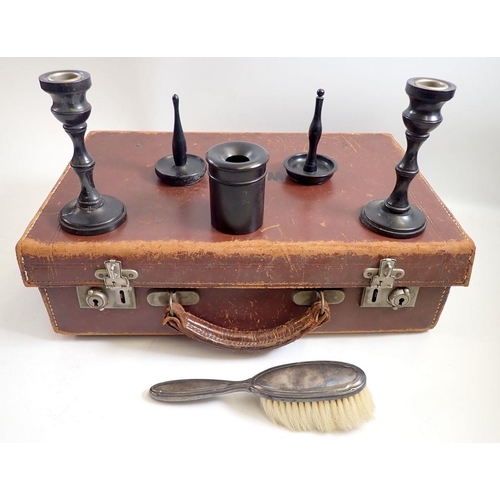 823 - An ebony dressing table set and a small leather suitcase