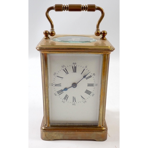 827 - A brass carriage clock, 11cm tall, rear glass panel a/f