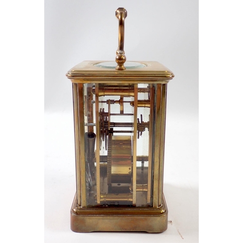 827 - A brass carriage clock, 11cm tall, rear glass panel a/f