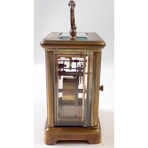 828 - A French brass cased 8 day carriage clock with platform lever escapement and Roman dial, 12cm tall