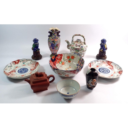 83 - A group of oriental ceramics including Japanese Sumida vase, dogs of Fo, Chinese famille verte teapo... 