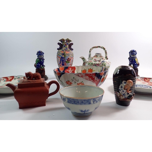 83 - A group of oriental ceramics including Japanese Sumida vase, dogs of Fo, Chinese famille verte teapo... 