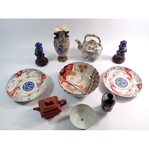 83 - A group of oriental ceramics including Japanese Sumida vase, dogs of Fo, Chinese famille verte teapo... 