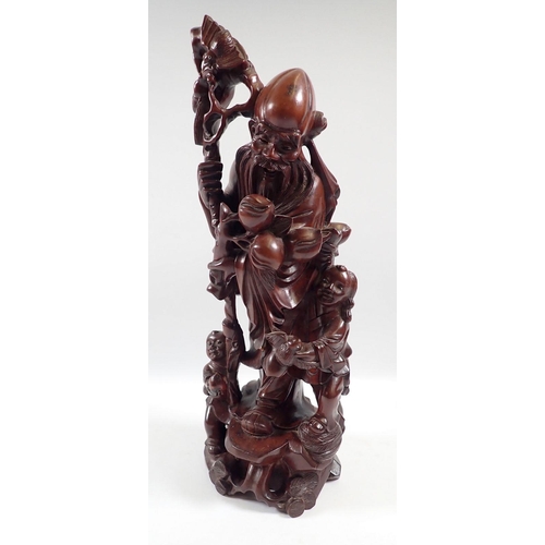 830 - A Chinese root carving of Shoulao, 31cm tall