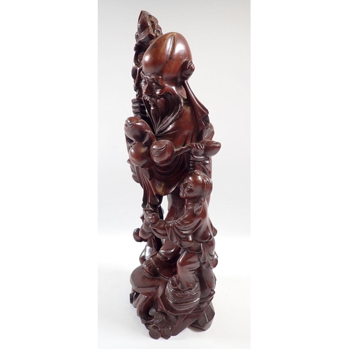 830 - A Chinese root carving of Shoulao, 31cm tall