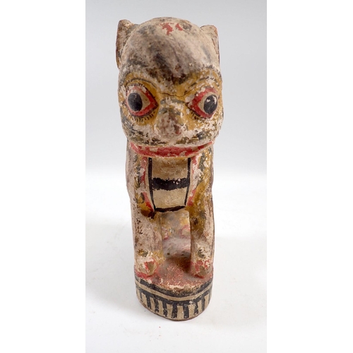 833 - A South American painted and carved wooden lion, 15.5cm tall