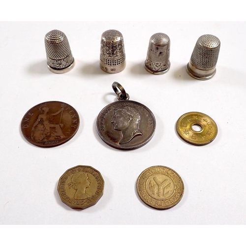 834 - A Napoleon 1807 Paix et Commerce medallion, a Chinese coin, a New York NYC token, two silver thimble... 