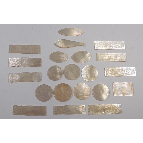 843 - Twenty one Chinese mother of pearl gaming tokens, engraved