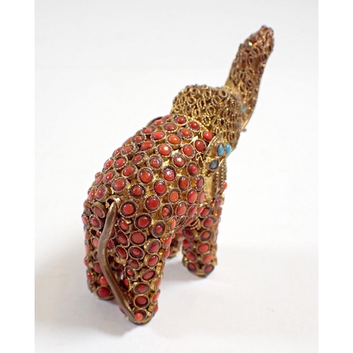 846 - An Indian gilt metal elephant set coral and turquoise, 5.5cm tall