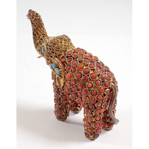 846 - An Indian gilt metal elephant set coral and turquoise, 5.5cm tall