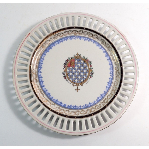 85 - A Vienna style armorial plate with pierced border, 25cm diameter