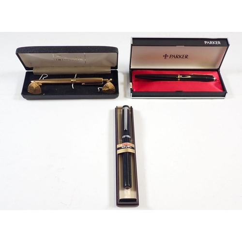 863 - A black and gold Parker fountain pen - cased, a Pentel Rolling writer - cased and a Grendale pen and... 