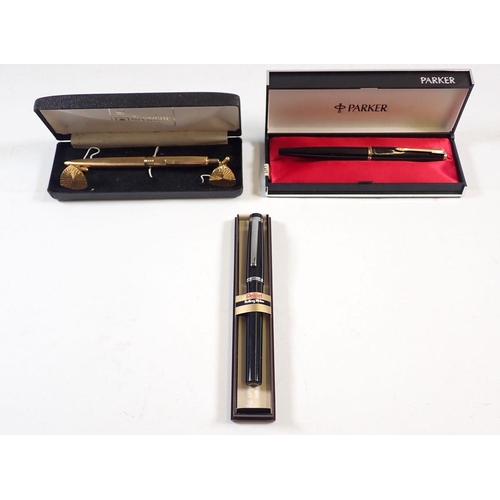 863 - A black and gold Parker fountain pen - cased, a Pentel Rolling writer - cased and a Grendale pen and... 