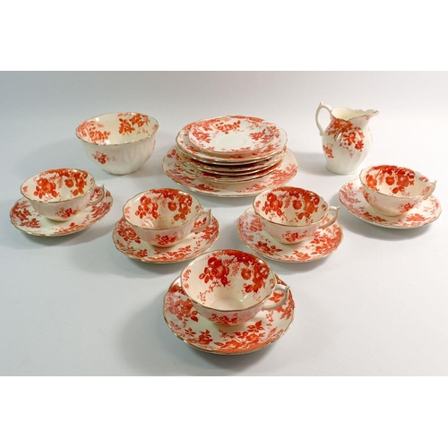 88 - A Moore orange floral printed tea serivce compirisng five cups and six saucers and six tea plates, c... 