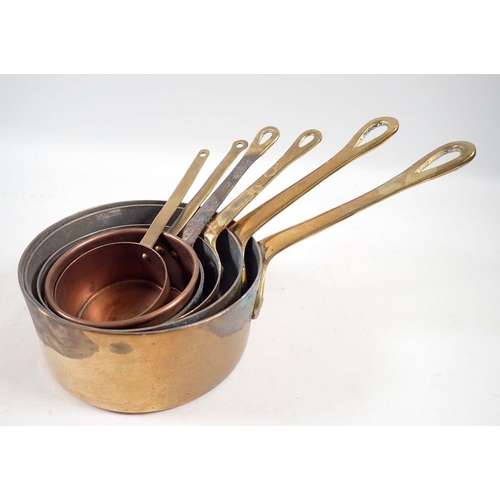 886 - A small set of copper saucepans, largest 9.5cm diameter