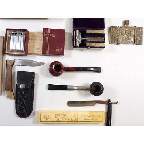 913 - Various cigarette lighters, cigarette cards inlcuding Cavanders and Westminster, pipes, razors etc.