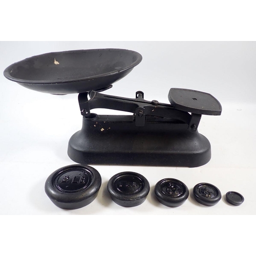 925 - A set of cast iron kitchen scales and weights