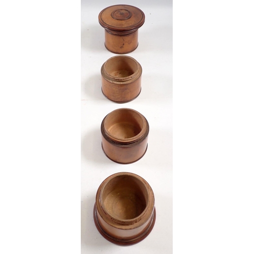 959 - A Victorian turned treen spice box with four ciruclar sections, 19.5cm tall