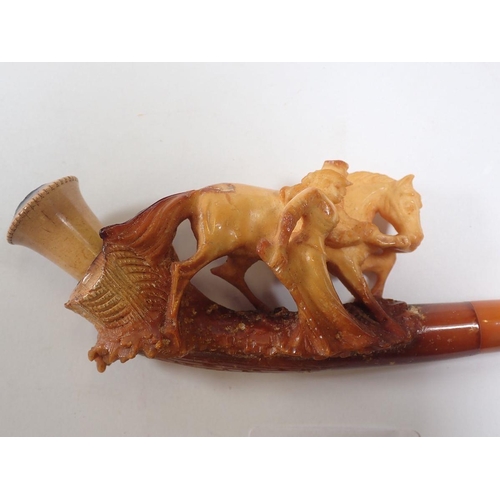 964 - A large amber and meerschaum pipe with carved lady and horse - cased