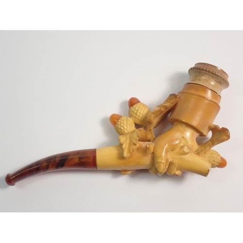 966 - An amber and meerschaum cheroot holder carved as a hand holding a branch of acorns - cased