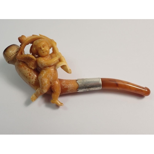 967 - An amber and meerschaum cheroot holder with carved cherub holding spray of foliage - cased