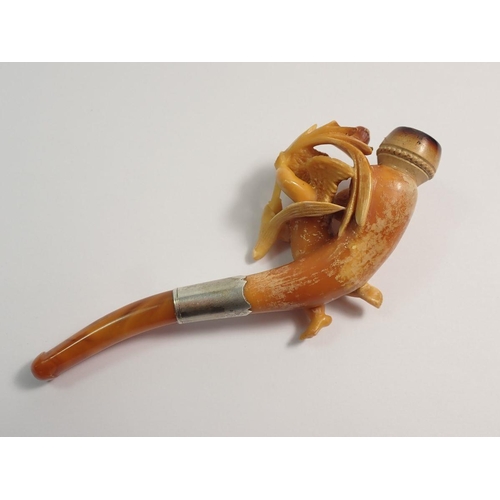 967 - An amber and meerschaum cheroot holder with carved cherub holding spray of foliage - cased