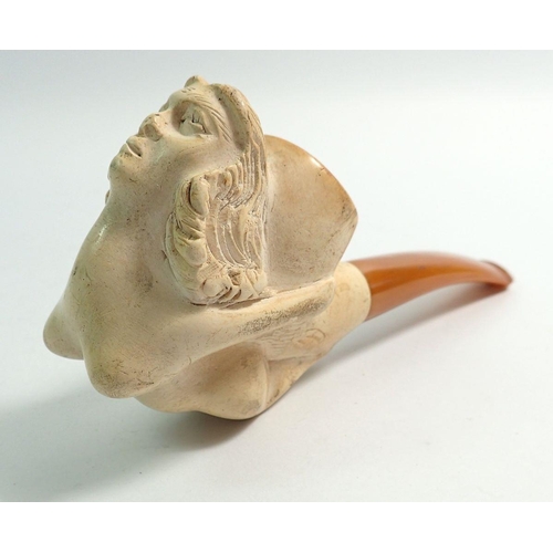 974 - An amber and meerschaum pipe with carved ships maiden masthead - uncased with associated leaflet