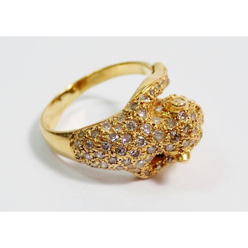 432 - An 18 carat gold diamond set ring in the form of a leopard, with ruby eyes, size K, 5.5g