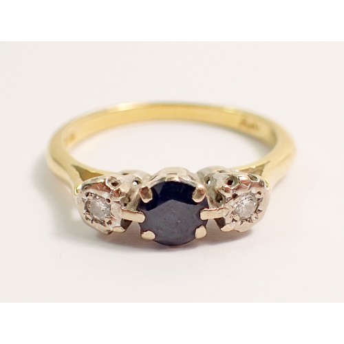 425 - An 18 carat gold and platinum sapphire and diamond ring, size P, 3.4g